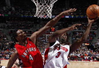 AUBURN HILLS, MI - JANUARY 15:  Rodney Stuckey #3 of the Detroit Pistons tries to get a shot off around Chris Bosh #4 of the Toronto Raptors on January 15, 2008 at the Palace of Auburn Hills in Auburn Hills, Michigan. Detroit won the game 103-89. NOTE TO USER: User expressly acknowledges and agrees that, by downloading and or using this photograph, User is consenting to the terms and conditions of the Getty Images License Agreement.  (Photo by Gregory Shamus/Getty Images)