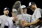 NEW YORK - NOVEMBER 04:  (L-R) Andy Pettitte #46, Jorge Posada #20, Derek Jeter #2 and Mariano Rivera #42 of the New York Yankees celebrate with the trophy after their 7-3 win against the Philadelphia Phillies in Game Six of the 2009 MLB World Series at Yankee Stadium on November 4, 2009 in the Bronx borough of New York City.  (Photo by Pool/Getty Images)