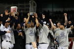 NEW YORK - NOVEMBER 04:  Mariano Rivera #42 of the New York Yankees holds up the trophy as he celebrates with his teammates after their 7-3 win against the Philadelphia Phillies in Game Six of the 2009 MLB World Series at Yankee Stadium on November 4, 2009 in the Bronx borough of New York City.  (Photo by Chris McGrath/Getty Images)