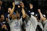 NEW YORK - NOVEMBER 04:  Mariano Rivera #42 of the New York Yankees holds up the trophy as he celebrates with his teammates after their 7-3 win against the Philadelphia Phillies in Game Six of the 2009 MLB World Series at Yankee Stadium on November 4, 2009 in the Bronx borough of New York City.  (Photo by Chris McGrath/Getty Images)