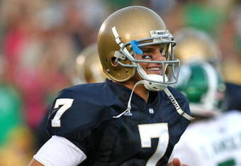 SOUTH BEND, IN - SETPEMBER 19: Jimmy Clausen #7 of the Notre Dame Fighting Irish smiles as he leaves the field after a win over the Michigan State Spartans on September 19, 2009 at Notre Dame Stadium in South Bend, Indiana. Notre Dame defeated Michigan State 33-30. (Photo by Jonathan Daniel/Getty Images)