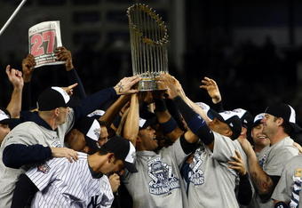 NEW YORK - NOVEMBER 04:  The New York Yankees celebrate with the trophy after their 7-3 win against the Philadelphia Phillies in Game Six of the 2009 MLB World Series at Yankee Stadium on November 4, 2009 in the Bronx borough of New York City.  (Photo by Chris McGrath/Getty Images)
