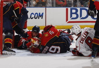 SUNRISE, FL - NOVEMBER 4: Goaltender Tomas Vokoun #29 and Bryan McCabe #24 of the Florida Panthers go to the ice to block the shot by Matt Cullen #8 of the Carolina Hurricanes in the second period on November 4, 2009 at the BankAtlantic Center in Sunrise, Florida. (Photo by Joel Auerbach/Getty Images)
