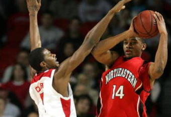LOUISVILLE, KY - DECEMBER 27:  Earl Clark #5 of the Louisville Cardinals defends Bennet Davis #14 of the Northeastern Huskies on December 27, 2006 at Freedom Hall in Louisville, Kentucky.  (Photo by Andy Lyons/Getty Images)