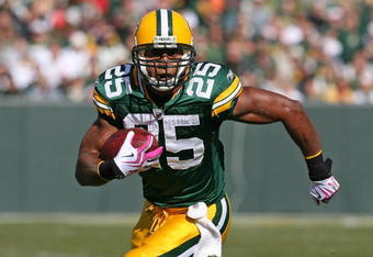 GREEN BAY, WI - OCTOBER 18: Ryan Grant #25 of the Green Bay Packers runs the ball against the Detroit Lions at Lambeau Field on October 18, 2009 in Green Bay, Wisconsin. The Packers defeated the Lions 26-0.  (Photo by Jonathan Daniel/Getty Images)