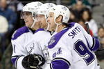 DALLAS - OCTOBER 19:  (L-R) Anze Kopitar #11, Justin Williams #14 and Ryan Smyth #94 of the Los Angeles Kings celebrate a goal against the Dallas Stars at American Airlines Center on October 19, 2009 in Dallas, Texas.  (Photo by Ronald Martinez/Getty Images)