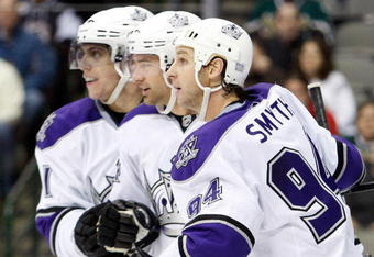 DALLAS - OCTOBER 19:  (L-R) Anze Kopitar #11, Justin Williams #14 and Ryan Smyth #94 of the Los Angeles Kings celebrate a goal against the Dallas Stars at American Airlines Center on October 19, 2009 in Dallas, Texas.  (Photo by Ronald Martinez/Getty Images)