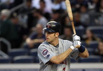 NEW YORK - OCTOBER 09:  Joe Mauer #7 of the Minnesota Twins bats against the New York Yankees in Game Two of the ALDS during the 2009 MLB Playoffs at Yankee Stadium on October 9, 2009 in the Bronx borough of New York City.  (Photo by Jim McIsaac/Getty Images)