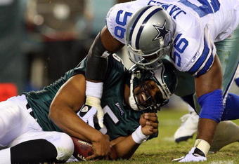 PHILADELPHIA - DECEMBER 28:  Bradie James #56 of the Dallas Cowboys sacks Donovan McNabb #5 of the Philadelphia Eagles on December 28, 2008 at Lincoln Financial Field in Philadelphia, Pennsylvania.  (Photo by Jim McIsaac/Getty Images)