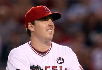 ANAHEIM, CA - OCTOBER 22:  John Lackey #41 of the Los Angeles Angels of Anaheim reacts in Game Five of the ALCS against the New York Yankees during the 2009 MLB Playoffs at Angel Stadium on October 22, 2009 in Anaheim, California.  (Photo by Stephen Dunn/Getty Images)