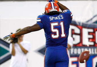 JACKSONVILLE, FL - OCTOBER 31:  Brandon Spikes #51 of the Florida Gators tosses the ball after intercepting a pass for a touchdown against the Georgia Bulldogs at Jacksonville Municipal Stadium on October 31, 2009 in Jacksonville, Florida.  (Photo by Kevin C. Cox/Getty Images)
