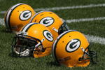 GREEN BAY, WI - AUGUST 03: Helmets sit on the field during the Green Bay Packers practice at summer training camp on August 3, 2009 at the Ray Nitschke Field in Green Bay, Wisconsin. (Photo by Jonathan Daniel/Getty Images)