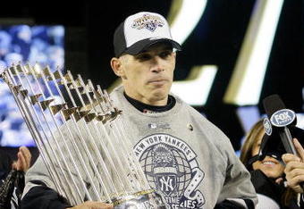 NEW YORK - NOVEMBER 04:  Manager Joe Girardi #27 of the New York Yankees celebrate after their 7-3 win against the Philadelphia Phillies in Game Six of the 2009 MLB World Series at Yankee Stadium on November 4, 2009 in the Bronx borough of New York City.  (Photo by Pool/Getty Images)