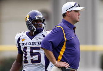 CHAPEL HILL, NC - SEPTEMBER 19:  Head coach Skip Holtz of the East Carolina Pirates watches on with his quarterback Patrick Pinkney #15 against the North Carolina Tar Heels at Kenan Stadium on September 19, 2009 in Chapel Hill, North Carolina.  (Photo by Streeter Lecka/Getty Images)