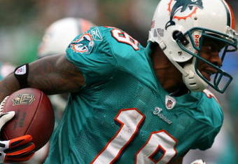 EAST RUTHERFORD, NJ - NOVEMBER 01:  Ted Ginn #19 of the Miami Dolphins returns a kick off during a game against the New York Jets at Giants Stadium on November 1, 2009 in East Rutherford, New Jersey.  (Photo by Chris Trotman/Getty Images)