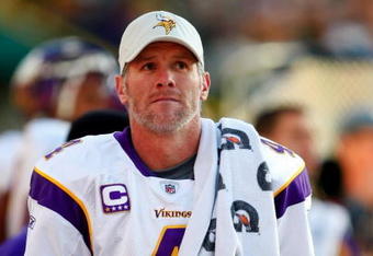 GREEN BAY, WI - NOVEMBER 01: Quarterback Brett Favre #4 of the Minnesota Vikings walks on the sidelines during the first quarter of the game against the Green Bay Packers at Lambeau Field on November 1, 2009 in Green Bay, Wisconsin. (Photo by Scott Boehm/Getty Images)