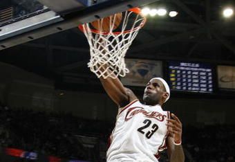 CLEVELAND - NOVEMBER 05:  LeBron James #23 of the Cleveland Cavaliers gets in for a dunk in front of Tyrus Thomas #24 of the Chicago Bulls on November 5, 2008 at the Quicken Loans Arena in Cleveland, Ohio. Cleveland won the game 107-93. NOTE TO USER: User expressly acknowledges and agrees that, by downloading and or using this photograph, User is consenting to the terms and conditions of the Getty Images License Agreement.  (Photo by Gregory Shamus/Getty Images)