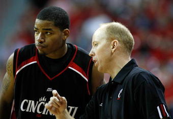 LAS VEGAS - NOVEMBER 29:  Dion Dixon #3 of Cincinnati talks to head coach Mick Cronin during a game against UNLV during the Global Sports Classic tournament at the Thomas & Mack Center November 29, 2008 in Las Vegas, Nevada. Cincinnati won 67-65.  (Photo by Ethan Miller/Getty Images)