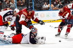 ATLANTA - NOVEMBER 05:  Goaltender Mathieu Garon #32 of the Columbus Blue Jackets saves a shot on goal in front of Nik Antropov #80 and Rich Peverley #47 of the Atlanta Thrashers at Philips Arena on November 5, 2009 in Atlanta, Georgia.  (Photo by Kevin C. Cox/Getty Images)