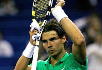 SHANGHAI, CHINA - OCTOBER 15:  Rafael Nadal of Spain acknowledges the crowd afer his victory over Tommy Robredo during day five of the 2009 Shanghai ATP Masters 1000 at Qi Zhong Tennis Centre on October 15, 2009 in Shanghai, China.  (Photo by Matthew Stockman/Getty Images)