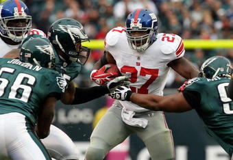PHILADELPHIA - NOVEMBER 01:  Brandon Jacobs #27 of the New York Giants is stopped on a run by the defense of the Philadelphia Eagles on November 1, 2009 at Lincoln Financial Field in Philadelphia, Pennsylvania. The Eagles defeated the Giants 40-17.  (Photo by Jim McIsaac/Getty Images)