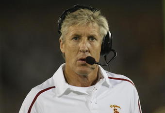 LOS ANGELES, CA - OCTOBER 24:  Head coach Pete Carroll of the USC Trojans talks on his headset against the Oregon State Beavers on October 24, 2009 at the Los Angeles Coliseum in Los Angeles, California.  USC won 42-36.  (Photo by Jeff Golden/Getty Images)
