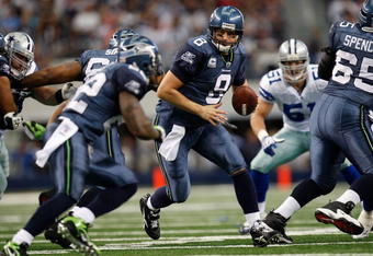 ARLINGTON, TX - NOVEMBER 01:  Quarterback Matt Hasselbeck #8 of the Seattle Seahawks drops back to pass against the Dallas Cowboys at Cowboys Stadium on November 1, 2009 in Arlington, Texas.  (Photo by Ronald Martinez/Getty Images)