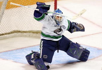 SAN JOSE, CA - SEPTEMBER 18:  Goalie Andrew Raycroft #30 of the Vancouver Canucks in action during their preseason game against the San Jose Sharks at the HP Pavilion on September 18, 2009 in San Jose, California. Joe Loprieno #42 is playing defense for the Sharks.  (Photo by Ezra Shaw/Getty Images)