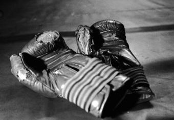 4 Dec 2000:  A pair of Muay Thai Kickboxing gloves show that the facilities at the gym in Klong Toei section of Bangkok, Thailand are nowhere near the standards of gyms in the United States. (Photo by Ezra Shaw/Getty Images)