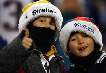 FOXBORO, MA - DECEMBER 09:  A fan of the New England Patriots and a fan of the Pittsburgh Steelers at Gillette Stadium on December 9, 2007 in Foxboro, Massachusetts. (Photo by Jim Rogash/Getty Images)