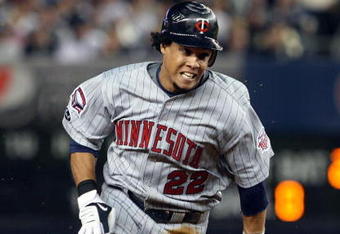 NEW YORK - OCTOBER 09:  Carlos Gomez #22 of the Minnesota Twins runs against the New York Yankees in Game Two of the ALDS during the 2009 MLB Playoffs at Yankee Stadium on October 9, 2009 in the Bronx borough of New York City.  (Photo by Jim McIsaac/Getty Images)