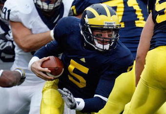ANN ARBOR, MI - OCTOBER 24:  Tate Forcier #5 of the Michigan Wolverines carries the ball during the game against the Penn State Nittany Lions on October 24, 2009 at Michigan Stadium in Ann Arbor, Michigan. (Photo by  Gregory Shamus/Getty Images)