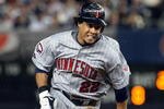 NEW YORK - OCTOBER 09:  Carlos Gomez #22 of the Minnesota Twins runs against the New York Yankees in Game Two of the ALDS during the 2009 MLB Playoffs at Yankee Stadium on October 9, 2009 in the Bronx borough of New York City.  (Photo by Jim McIsaac/Getty Images)