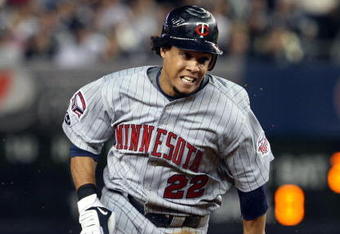 NEW YORK - OCTOBER 09:  Carlos Gomez #22 of the Minnesota Twins runs against the New York Yankees in Game Two of the ALDS during the 2009 MLB Playoffs at Yankee Stadium on October 9, 2009 in the Bronx borough of New York City.  (Photo by Jim McIsaac/Getty Images)
