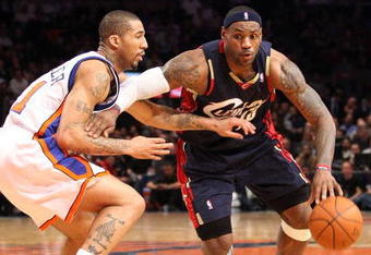 NEW YORK - FEBRUARY 04:  LeBron James #23 of the Cleveland Cavaliers drives the ball to the basket against Wilson Chandler #21 of the New York Knicks on February 4, 2009 at Madison Square Garden in New York City. NOTE TO USER: User expressly acknowledges and agrees that, by downloading and or using this photograph, User is consenting to the terms and conditions of the Getty Images License Agreement.  (Photo by Nick Laham/Getty Images)