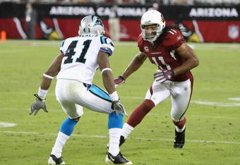 GLENDALE, AZ - NOVEMBER 01:  Wide receiver Larry Fitzgerald #11 of the Arizona Cardinals runs from the line of scrimage during the NFL game against the Carolina Panthers at the Universtity of Phoenix Stadium on November 1, 2009 in Glendale, Arizona. The Panthers defeated the Cardinals 34-21.  (Photo by Christian Petersen/Getty Images)