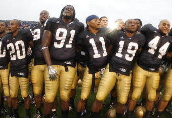 SOUTH BEND, IN - SEPTEMBER 13: Golden Tate #23, Pat Kuntz #96, Asaph Schwapp #44, George West #19, David Grimes #11, Emeka Nwankwo #91 and Terrail Lambert #20 of the Notre Dame Fighting Irish celebrate after a 35-17 victory over the Michigan Wolverines on September 13, 2008 at Notre Dame Stadium in South Bend, Indiana.  (Photo by Gregory Shamus/Getty Images)