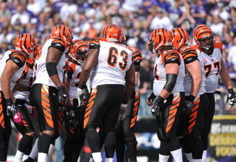 BALTIMORE - OCTOBER 11:  The Cincinnati Bengals offense huddles during the game against the Baltimore Ravens at M&T Bank Stadium on October 11, 2009 in Baltimore, Maryland. The Bengals defeated the Ravens 17-14. (Photo by Larry French/Getty Images)