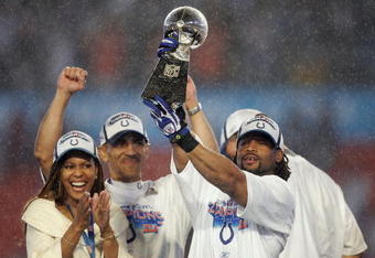 MIAMI GARDENS, FL - FEBRUARY 04:  Bob Sanders #21 of  the Indianapolis Colts celebrates with the Vince Lombardi Trophy, next to head coach Tony Dungy and his wife Lauren Dungy, after the Colts 29-17 win against the Chicago Bears in Super Bowl XLI on February 4, 2007 at Dolphin Stadium in Miami Gardens, Florida.  (Photo by Jonathan Daniel/Getty Images)