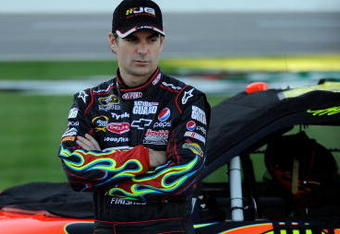 FORT WORTH, TX - NOVEMBER 06:  Jeff Gordon, driver of the #24 DuPont Chevrolet, stands on pit road after qualifying for the NASCAR Sprint Cup Series Dickies 500 at Texas Motor Speedway on November 6, 2009 in Fort Worth, Texas.  (Photo by John Harrelson/Getty Images for NASCAR)