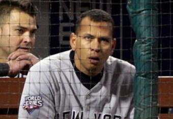 PHILADELPHIA - NOVEMBER 02:  Nick Swisher #33 (L), Alex Rodriguez #13 (2nd L) and Derek Jeter #2 (R) of the New York Yankees look on from the dugout against the Philadelphia Phillies in Game Five of the 2009 MLB World Series at Citizens Bank Park on November 2, 2009 in Philadelphia, Pennsylvania.  (Photo by Jed Jacobsohn/Getty Images)