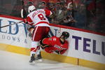 CALGARY, CANADA - OCTOBER 31:   Justin Abdelkader #8 of the Detroit Red Wings checks Mark Giordano #5 the Calgary Flames on October 31st, 2009 at the Pengrowth Saddledome in Calgary, Alberta, Canada. (Photo by Dale MacMillan/Getty Images)