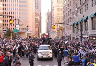 NEW YORK - NOVEMBER 06:  Derek Jeter # 2 and Jorge Posada # 20 of the New York Yankees celebrate on a float during the Yankees World Series Victory Parade on November 6, 2009 in New York City.  (Photo by Michael Loccisano/Getty Images)