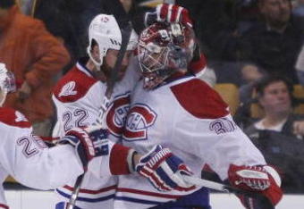 BOSTON - NOVEMBER 05:  Carey Price #31 of the Montreal Canadiens is congratulated by teammates Paul Mara #22 and Josh Gorges #26 the Boston Bruins on November 5, 2009 at the TD Garden in Boston, Massachusetts. The Canadiens defeated the Bruins 2-1 in an overtime shootout.  (Photo by Elsa/Getty Images)