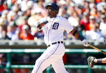 DETROIT - OCTOBER 1:  Marcus Thames #33 of the Detroit Tigers singles to center but advances to second on a fielding error by Delmon Young #21 of the Minnesota Twins in the second inning during the game on October 1, 2009 at Comerica Park in Detroit, Michigan. (Photo by Gregory Shamus/Getty Images)