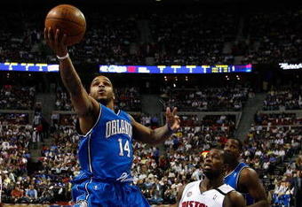 AUBURN HILLS, MI - MAY 13:  Jameer Nelson #14 of the Orlando Magic drives for a shot attempt against Rodney Stuckey #3 of the Detroit Pistons in Game Five of the Eastern Conference Semifinals during the 2008 NBA Playoffs at the Palace of Auburn Hills in Auburn Hills, Michigan.  NOTE TO USER: User expressly acknowledges and agrees that, by downloading and or using this photograph, User is consenting to the terms and conditions of the Getty Images License Agreement.  (Photo by Gregory Shamus/Getty Images)