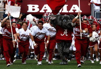 TUSCALOOSA, AL - OCTOBER 24:  The cheerleaders of the Alabama Crimson Tide lead the team onto the field to face the Tennessee Volunteers at Bryant-Denny Stadium on October 24, 2009 in Tuscaloosa, Alabama.  (Photo by Kevin C. Cox/Getty Images)