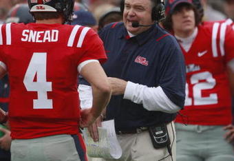 OXFORD, MS - OCTOBER 10:  Coach Houston Nutt of the Mississippi Rebels talks with quarterback Jevan Snead #4 during their game with the Alabama Crimson Tide at Vaught-Hemingway Stadium on October 10, 2009 in Oxford, Mississippi.  (Photo by Dave Martin/Getty Images)