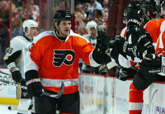 PHILADELPHIA - APRIL 21:  Daniel Carcillo #13 of the Philadelphia Flyers celebrates his goal against the Pittsburgh Penguins during Game Four of the Eastern Conference Quarterfinal Round of the 2009 NHL Stanley Cup Playoffs  at the Wachovia Center on April 21, 2009 in Philadelphia, Pennsylvania. The Penguins defeated the Flyers 3-1 to take a three games to one lead in the series.  (Photo by Jim McIsaac/Getty Images)