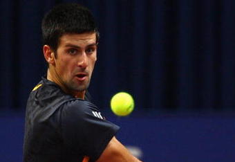 BASEL, SWITZERLAND - NOVEMBER 06:  Novak Djokovic of Serbia in action against Stanislas Wawrinka of Switzerland during Day Five of the Davidoff Swiss Indoors Tennis at St Jakobshalle on November 6, 2009 in Basel, Switzerland.  (Photo by Julian Finney/Getty Images)